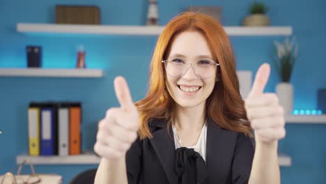Happy-cute-business-woman-looking-at-camera-and-making-positive-sign.